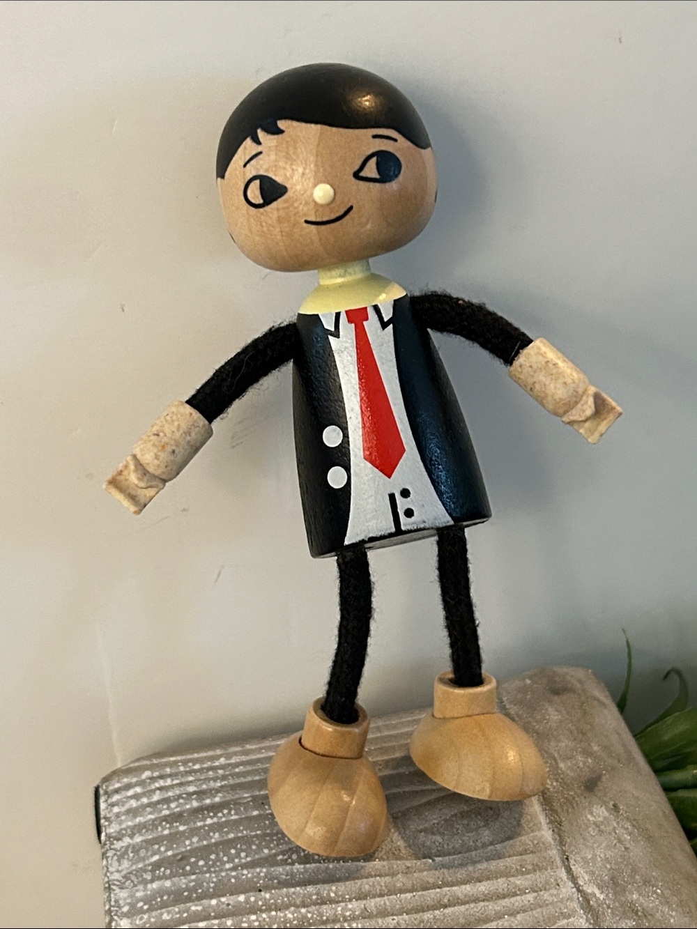 Hape Modern Family Dad wooden doll figurine, dressed in a black suit with a tie
